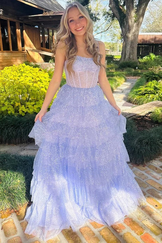 In the dress suggestions for ladies, can you provide some specific styles or brand recommendations?